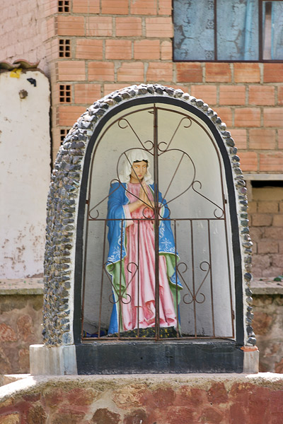 Saint near the church in Laja