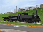 A smudgy little steam engine with two dumping platforms